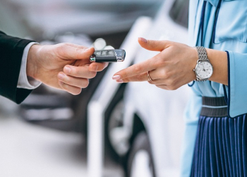 Female hands close up with car keys